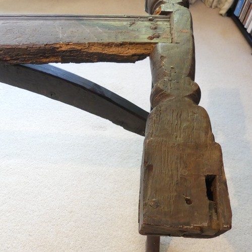 657 - A Georgian oak Refectory Table, the rectangular top above stile feet joined by a stretcher, stretche... 