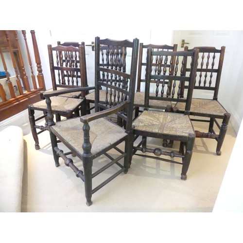 658 - A set of seven Georgian style Dining Chairs, with spindle back and rush seat, raised on turned legs ... 