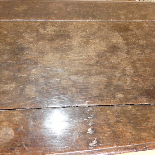 659 - An 18th century oak Coffer, with carved frieze and three carved panels, on stile feet, split to top ... 