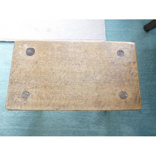 667 - An antique rustic Milking Stool, the rectangular top raised on round legs, W 46cm x D 26cm x H 25cm.... 