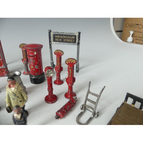 287 - A quantity of vintage '0' gauge lead station figures and accessories, including platform signs, vend... 