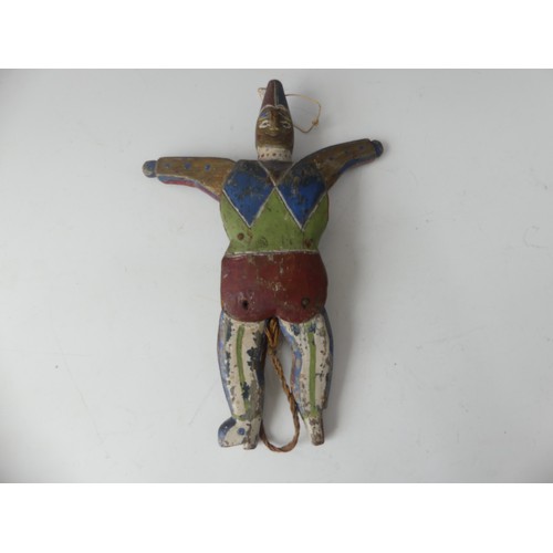 183 - A 19thC Folk Art carved pine and polychrome decorated Jumping Jack Toy, in the form of a Harlequin, ... 