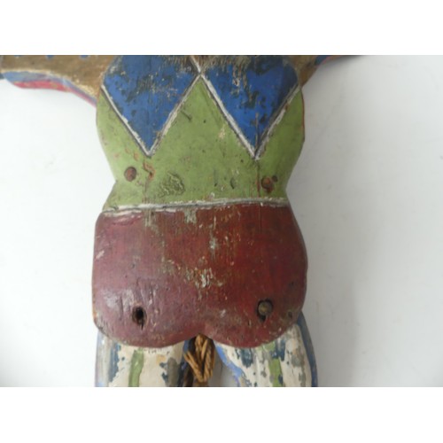 183 - A 19thC Folk Art carved pine and polychrome decorated Jumping Jack Toy, in the form of a Harlequin, ... 