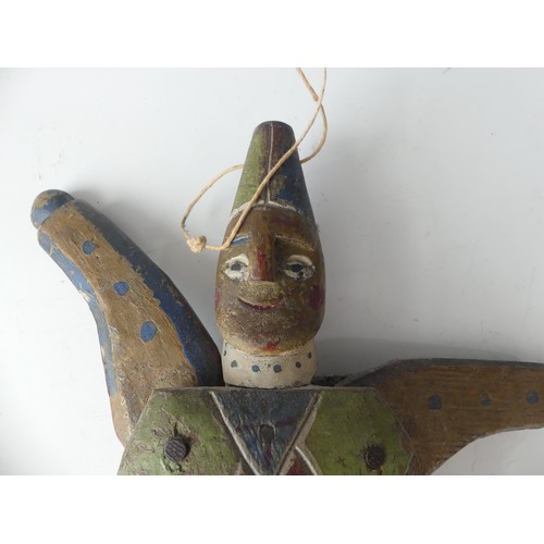 183 - A 19thC Folk Art carved pine and polychrome decorated Jumping Jack Toy, in the form of a Harlequin, ... 