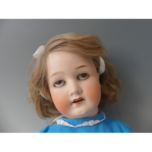 182 - A German Heubach Koppelsdorf bisque-headed Doll, with weighted brown eyes, open mouth with top teeth... 