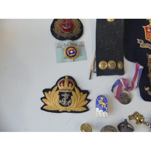 372 - A collection of Naval Uniform badges, Insignia and Uniform Buttons, Naval markings by Monnery's outf... 