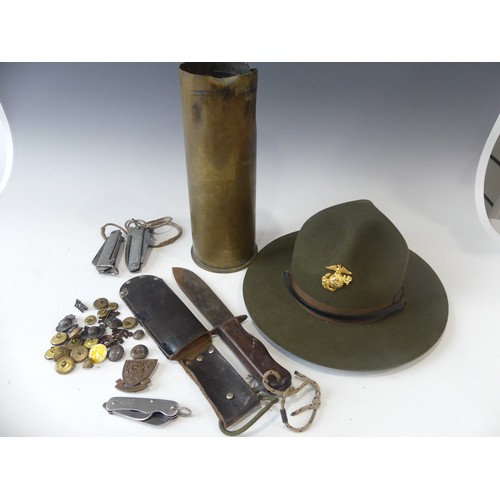 405 - A quantity of Militaria, including a French Commando's Marine Hat Badge, marked on the reverse A.B. ... 