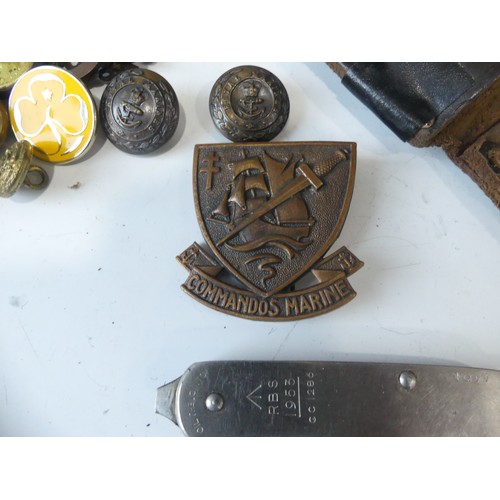 405 - A quantity of Militaria, including a French Commando's Marine Hat Badge, marked on the reverse A.B. ... 