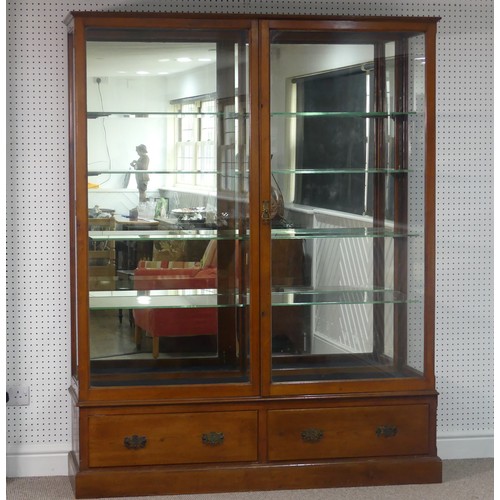 670 - An Edwardian oak framed and glazed commercial Shop Display Unit, with mirrored back and double doors... 