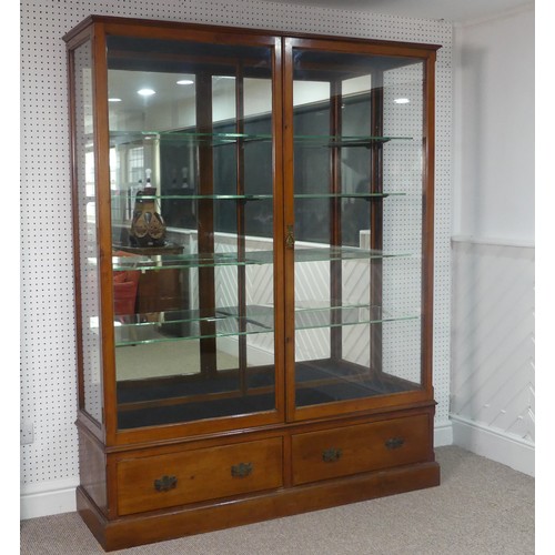 670 - An Edwardian oak framed and glazed commercial Shop Display Unit, with mirrored back and double doors... 