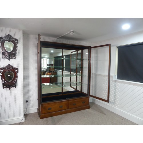 670 - An Edwardian oak framed and glazed commercial Shop Display Unit, with mirrored back and double doors... 