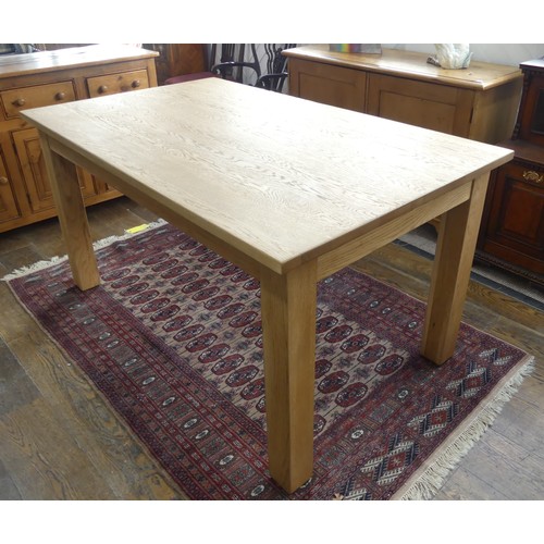 671 - A contemporary oak Dining Table, W 150cm x D 91cm x H 79cm.