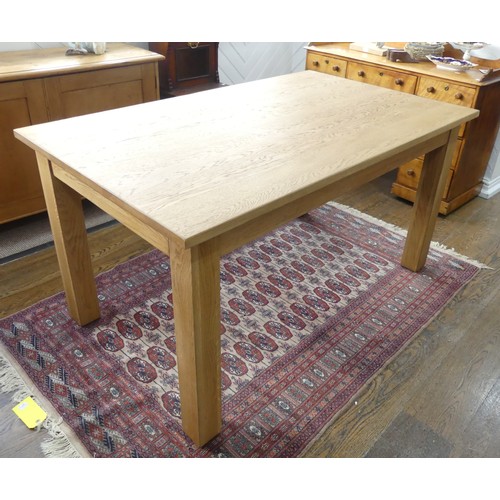 671 - A contemporary oak Dining Table, W 150cm x D 91cm x H 79cm.