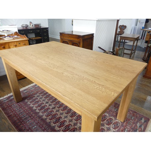 671 - A contemporary oak Dining Table, W 150cm x D 91cm x H 79cm.