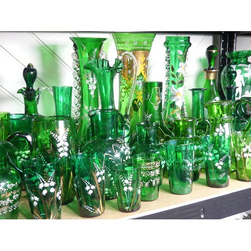 526 - A Mary Gregory Bristol green glass Decanter, together with a Vase with similar decoration and a quan... 