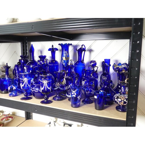 527 - A quantity of late 19thC Bristol blue Glassware, to include gilt and floral decorated Vases, Beakers... 