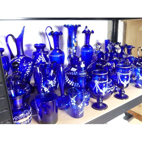 527 - A quantity of late 19thC Bristol blue Glassware, to include gilt and floral decorated Vases, Beakers... 