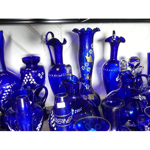 527 - A quantity of late 19thC Bristol blue Glassware, to include gilt and floral decorated Vases, Beakers... 