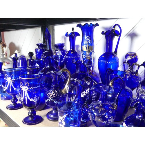 527 - A quantity of late 19thC Bristol blue Glassware, to include gilt and floral decorated Vases, Beakers... 