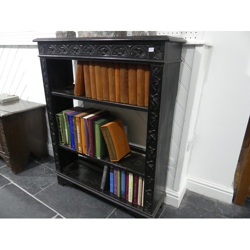 663 - A Victorian oak open Bookcase, heavily carved with three shelves, on bracket feet, W 86cm x D 28cm x... 