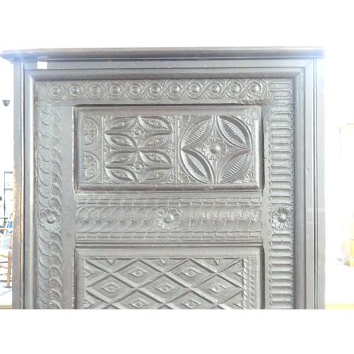 651 - An antique carved oak Cupboard, with heavily carved decoration, W 82cm x D 46cm x H 151cm.... 