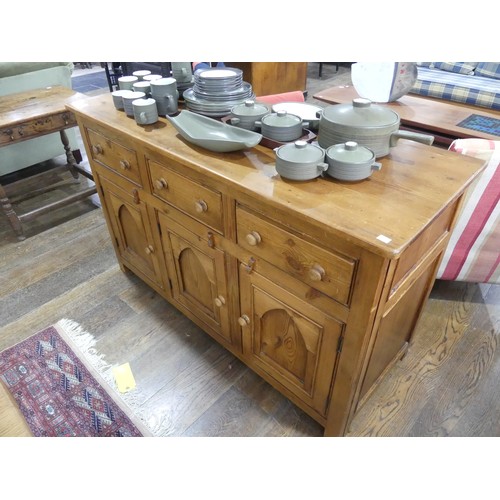 674 - A vintage pine Sideboard, the rectangular top above three frieze drawers and three cupboards below, ... 