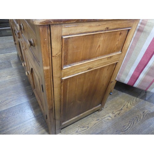 674 - A vintage pine Sideboard, the rectangular top above three frieze drawers and three cupboards below, ... 