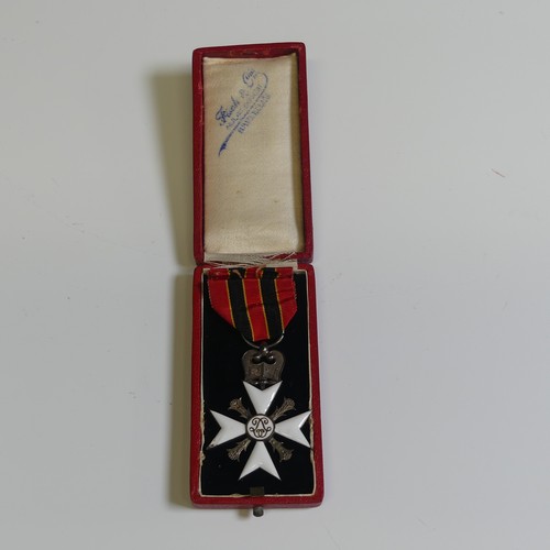 370 - A collection of eight Belgian orders and medals, including a “Croix D’or d’officier” of the Order of... 