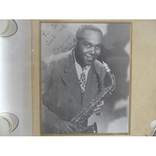 368 - Charlie Parker interest; a display case containing a silver plate saxophone made by Buescher, serial... 