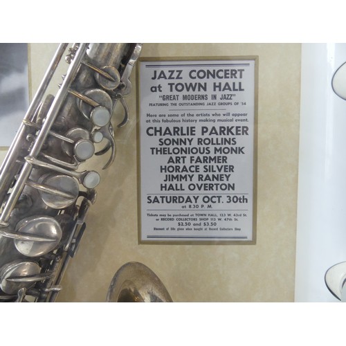 368 - Charlie Parker interest; a display case containing a silver plate saxophone made by Buescher, serial... 