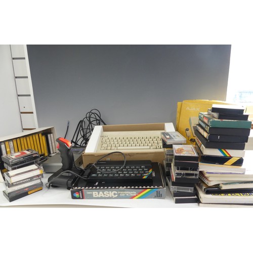 356 - A vintage 1980's ZX Spectrum computer, together with a SAGA 1 keyboard, original ZX case, quickshot ... 