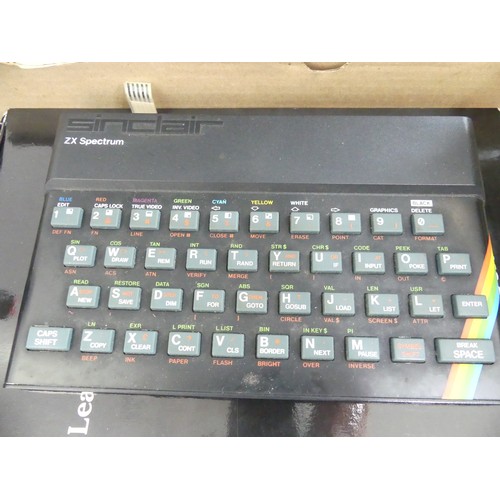 356 - A vintage 1980's ZX Spectrum computer, together with a SAGA 1 keyboard, original ZX case, quickshot ... 