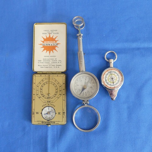 172 - A mid 20thC Ansonia Sunwatch, together with a Pathfinder Map Measure and a compass, all boxed... 