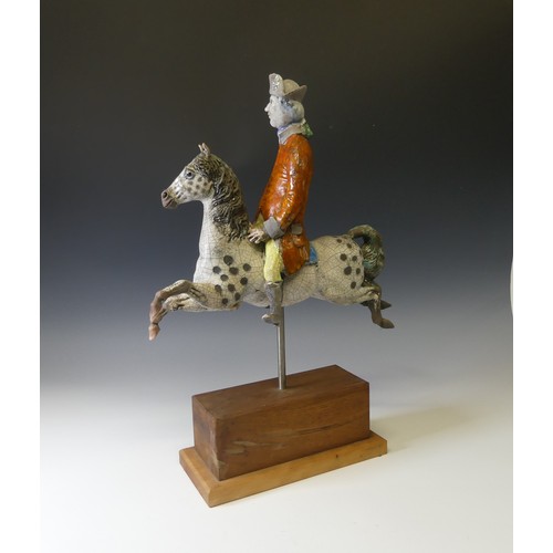 65 - Lawson E. Rudge (b. 1936), a raku fired studio pottery sculpture of George Stubbs, modelled riding a... 