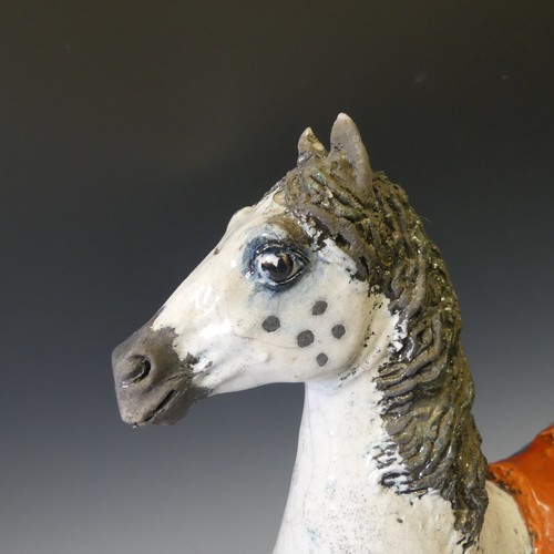 66 - Lawson E. Rudge (b. 1936), a raku fired studio pottery sculpture of a Carousel Horse, numbered 5 on ... 