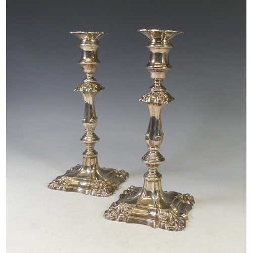 18 - A pair of Elizabeth II silver Candlesticks, by Barker Ellis Silver Co., hallmarked 1974/5, fluted kn... 