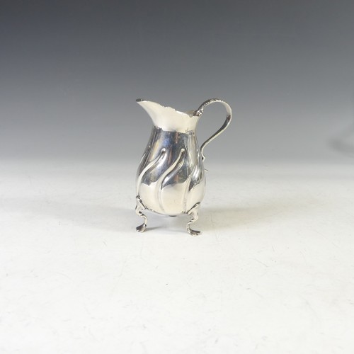 43 - A late Victorian silver Cream Jug, by Walker & Hall, hallmarked Birmingham, 1900, with swirl flu... 