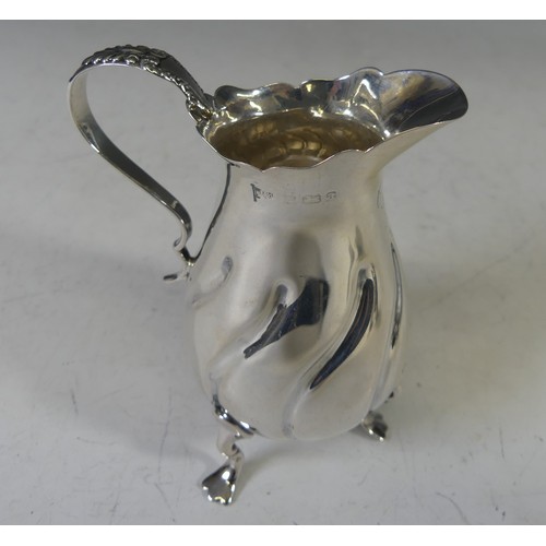 43 - A late Victorian silver Cream Jug, by Walker & Hall, hallmarked Birmingham, 1900, with swirl flu... 