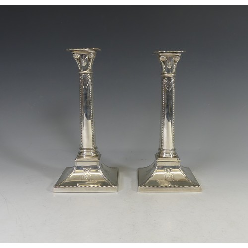 49 - A near pair of silver Column Candlesticks, by Thomas Bradbury & Sons Ltd., hallmarked London 190... 