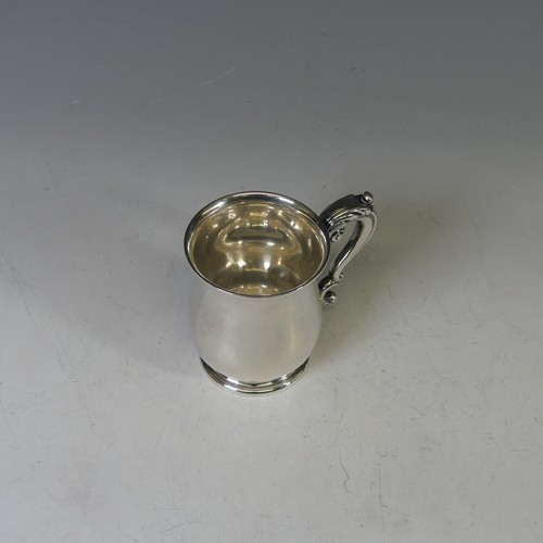 62 - A George V silver Mug, by William Neale & Son Ltd., hallmarked Birmingham, 1934, of baluster for... 