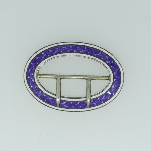 76 - A George V silver and enamel Buckle, by Lawrence Emanuel, hallmarked Birmingham 1910, oval with purp... 