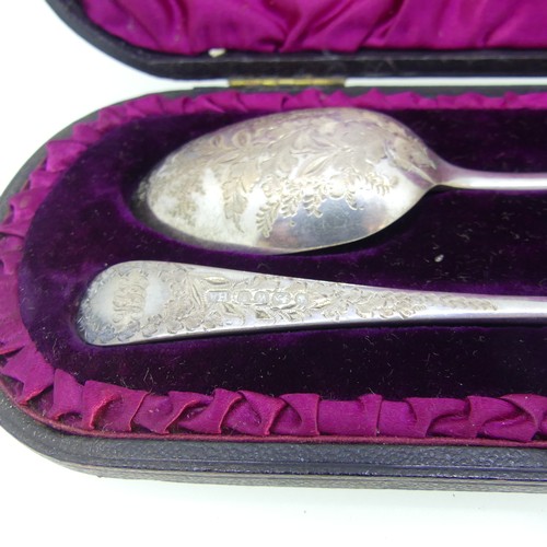 82 - A cased Victorian silver Spoon and Fork, by Atkin Brothers, hallmarked Sheffield, 1889, with foliate... 