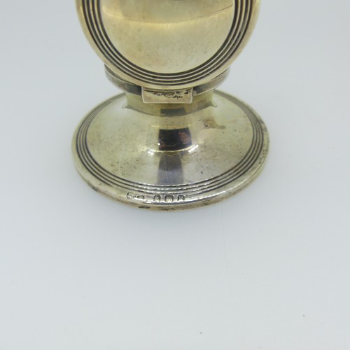 97 - An Edwardian silver Capstan Inkwell, hallmarked Birmingham 1909, of traditional form with reeded dec... 