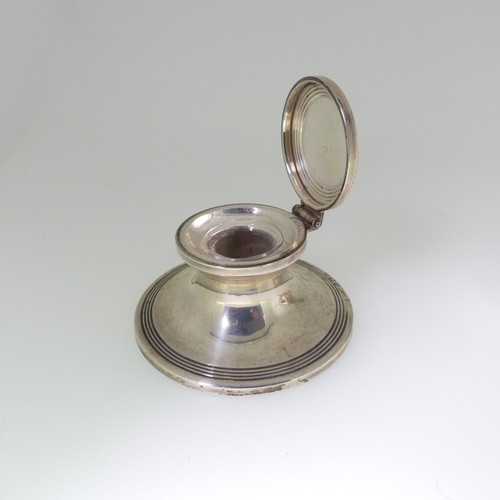 97 - An Edwardian silver Capstan Inkwell, hallmarked Birmingham 1909, of traditional form with reeded dec... 