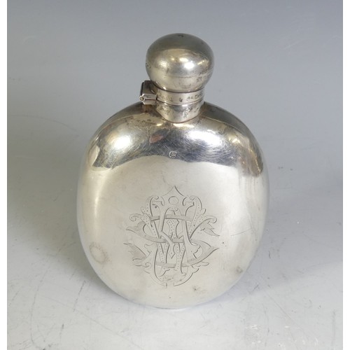 A late Victorian silver Hip Flask, by James Dixon & Sons, hallmarked Sheffield, 1895, of oval form with hinged bayonet cap and engraved with phoenix crest, inscribed 'Je Mourrai Pour Ceux Que Jamie', and monogram, 15cm high, appx. weight 5ozt.