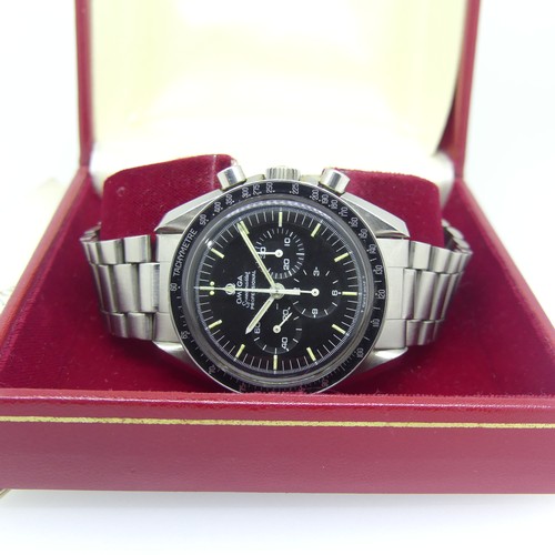 An Omega Speedmaster Professional stainless steel chronograph Wristwatch, reference 145.022-69 ST, 17-jewel cal. 861 manual wind movement no. 31613273, the black dial with luminous baton hour markers, white outer 1/5th second divisions, subsidiary dials at 3, 6 and 9 for seconds, 30 minute and 12 hour recording, white pointed baton hands with luminous centres, black tachymetre bezel, the screw down case back engraved 'The First Watch Worn on the Moon Flight-Qualified by NASA for all manned space missions', with Omega crown, 42mm case diameter, on an Omega stainless steel bracelet 633, in red Omega presentation case with booklet.
