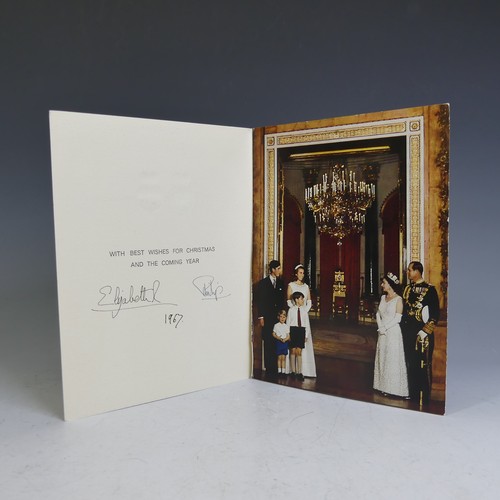 H.M.Queen Elizabeth II and H.R.H.The Duke of Edinburgh, signed 1967 Christmas card with twin gilt ciphers to cover, colour photograph of the Royal family standing in a formal pose at the side of a large doorway within Buckingham Palace, signed ‘Elizabeth R 1967 Philip’ (note that in common with all of these Christmas Cards post 1959, this card is signed with an autopen). Provenance: Mrs Deborah Bean (née King), CVO, Head of Information and Correspondence Section, Private Secretary’s Office – Lady Clerk to the Assistant Private Secretary to Queen Elizabeth II.