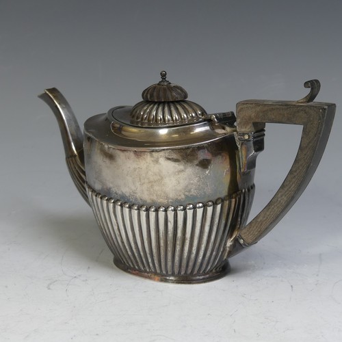 78 - A George V silver Teapot, by William Aitken, hallmarked Birmingham, 1910, of oval form with demi-flu... 