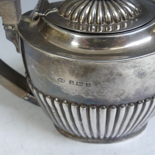 78 - A George V silver Teapot, by William Aitken, hallmarked Birmingham, 1910, of oval form with demi-flu... 