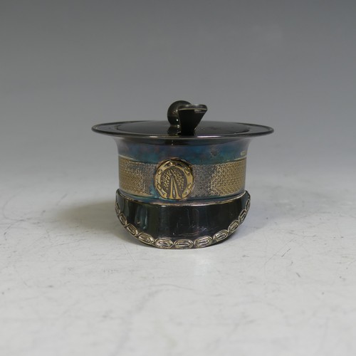 28 - A novelty silver plated Mustard Pot, in the form of a miltary officer's cap, with blue glass liner a... 